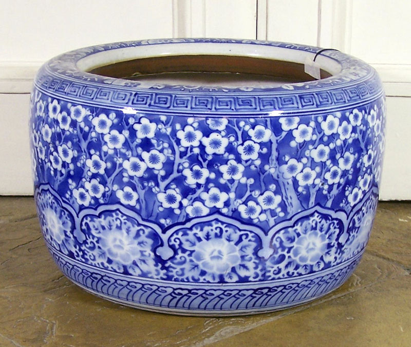 A Japanese ceramic circular form jardinière