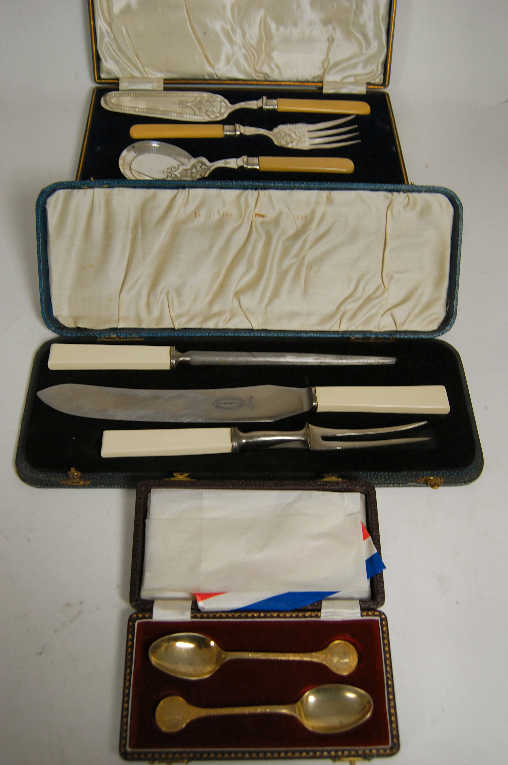 A collection of cased flatware