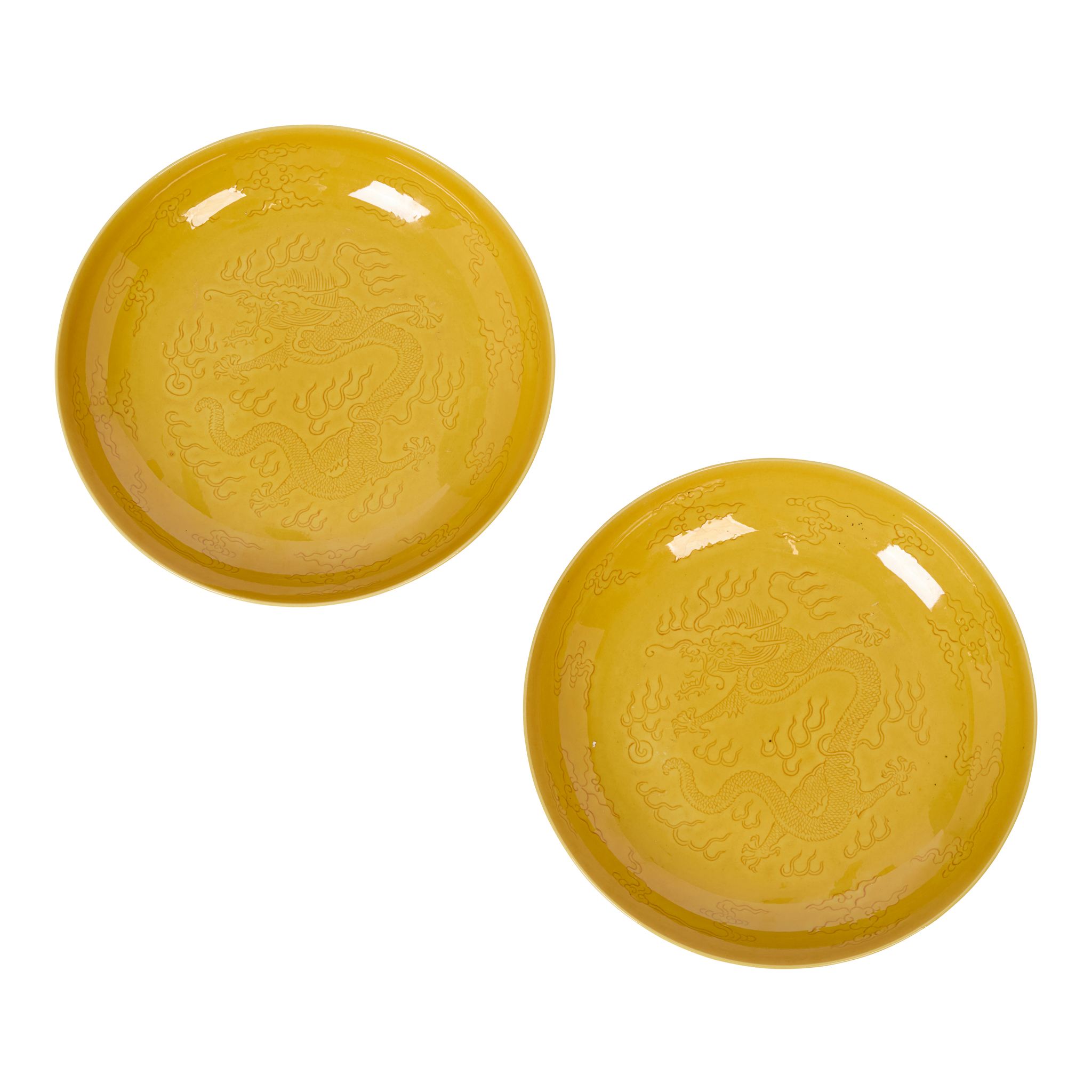 PAIR OF CHINESE CARVED YELLOW-GLAZED 'DRAGON' PLATES