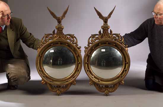 A pair of giltwood convex wall mirrors