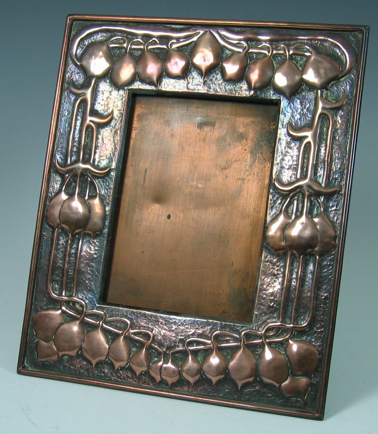 A Scottish School Arts and Crafts copper photograph frame,