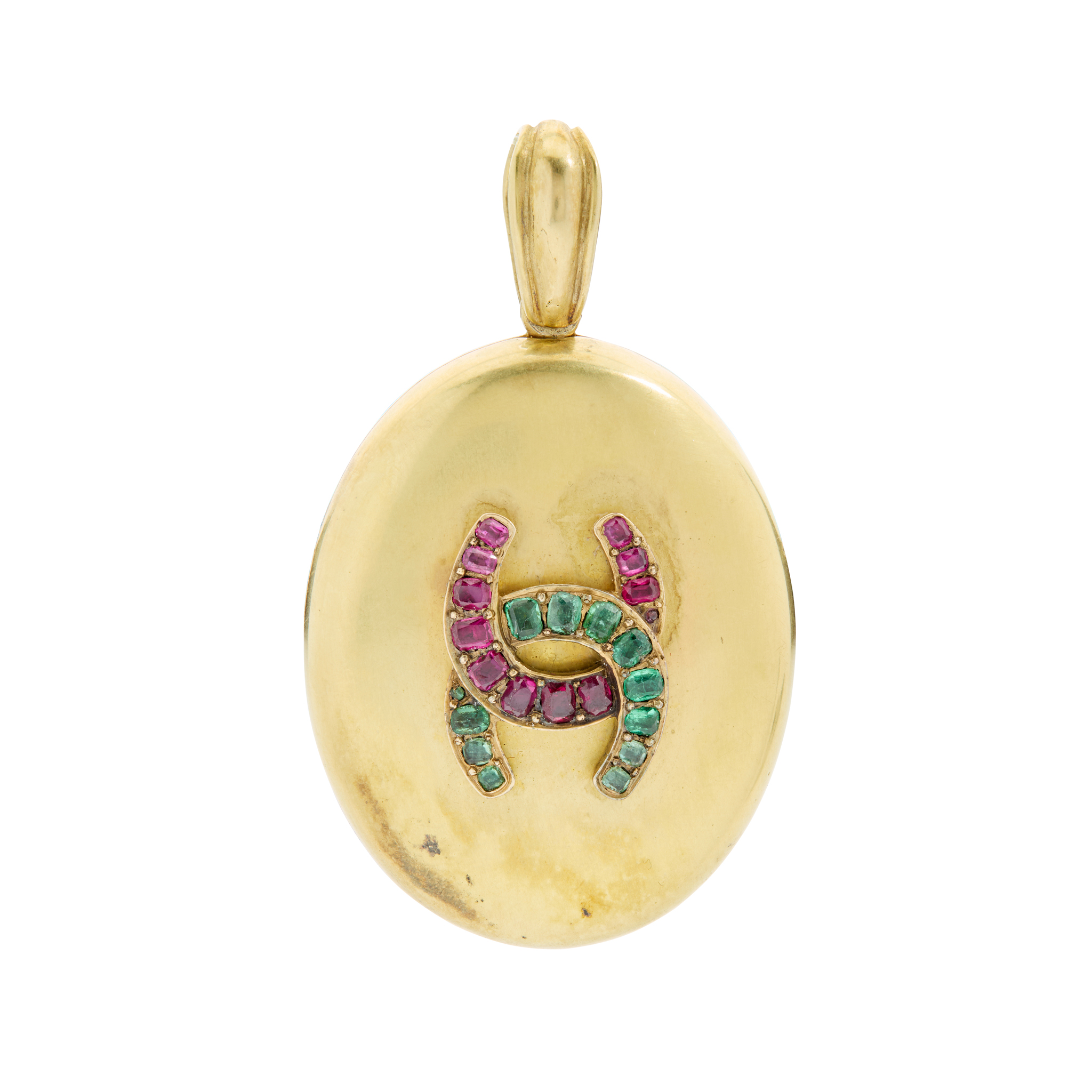 An emerald and ruby locket