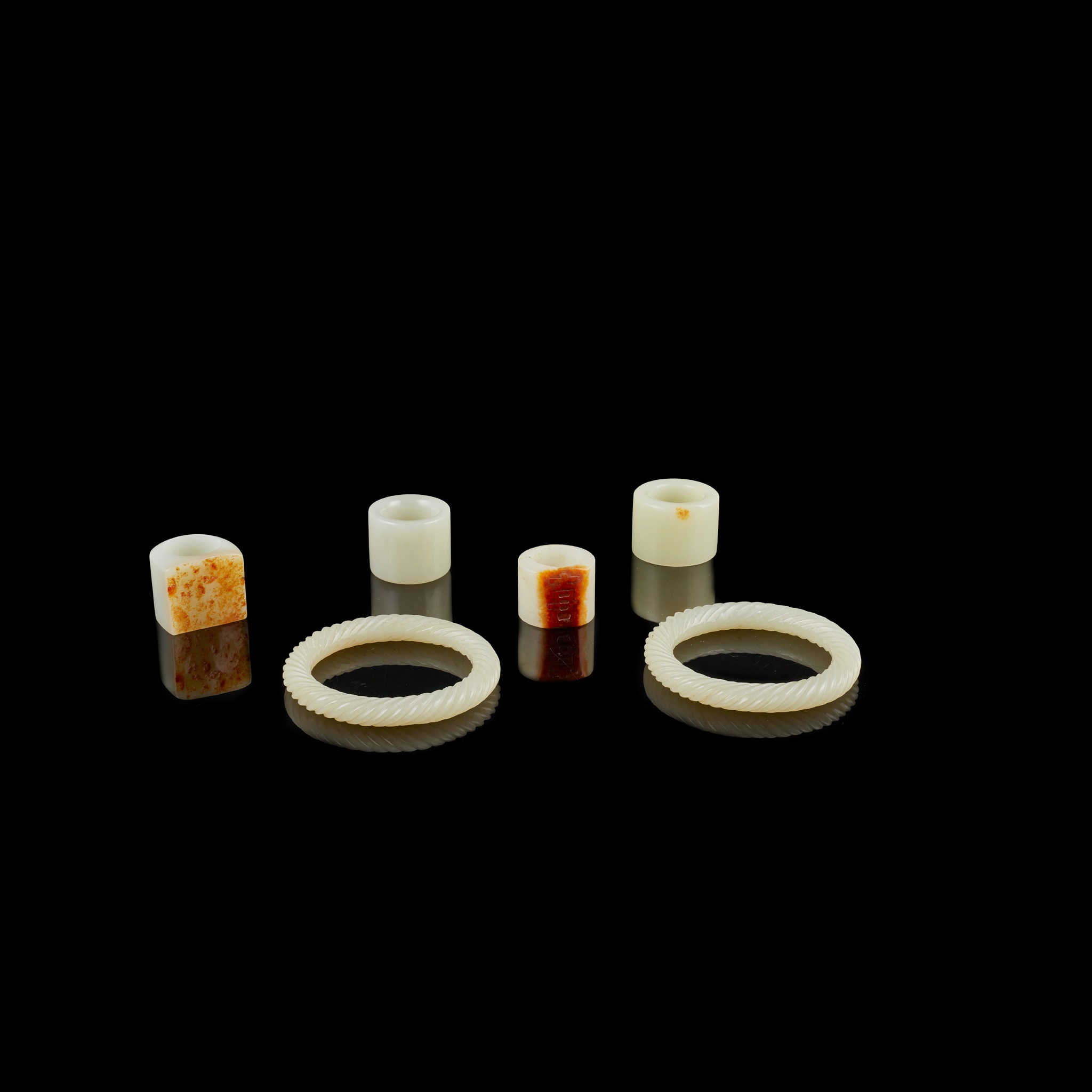 GROUP OF SIX PALE CELADON JADE ACCESSORIES