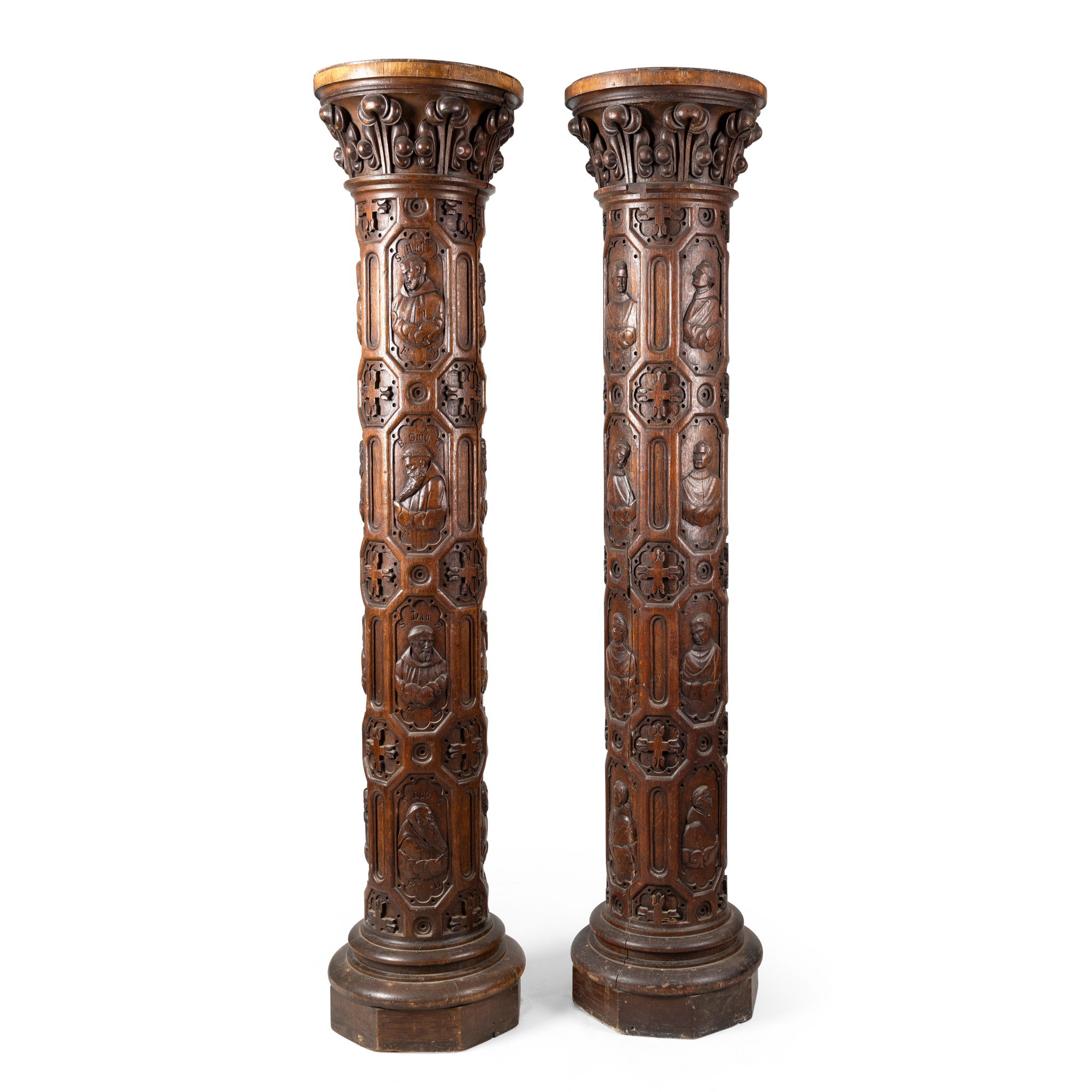 A PAIR OF CARVED OAK COLUMNS