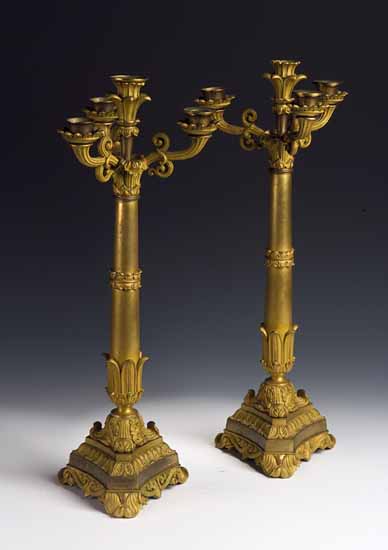 A pair of Regency neo-Grecian giltmetal table candlebra
