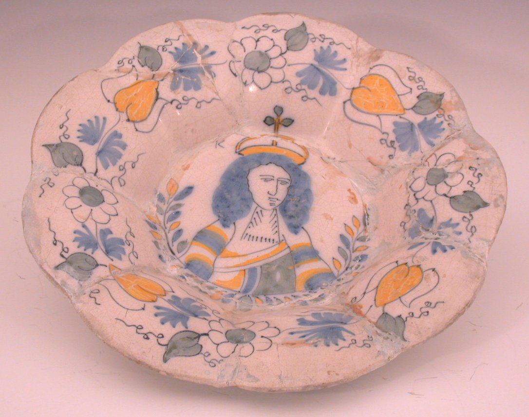 A late 17th century English Delft circular scalloped charger,