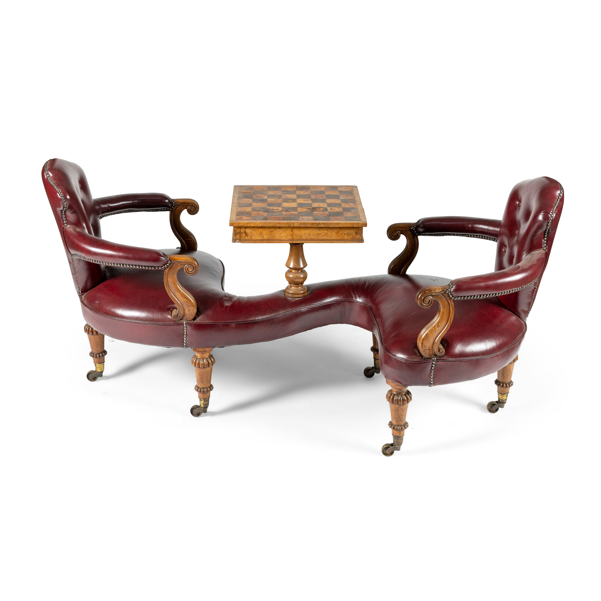 A VICTORIAN MAHOGANY CONVERSATION CHAIR