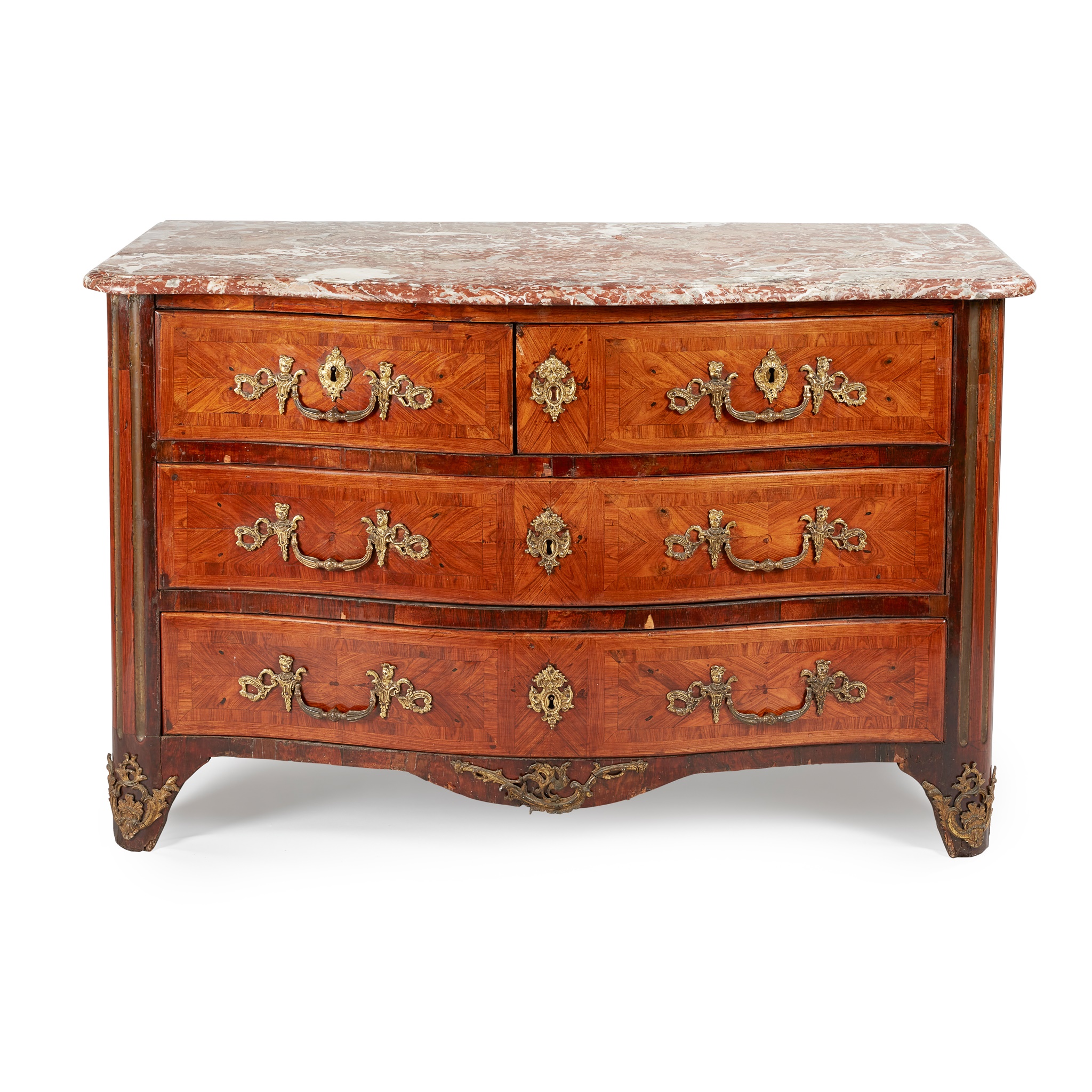 A FRENCH REGENCE KINGWOOD, GILT METAL, AND ORMOLU MOUNTED MARBLE TOPPED COMMODE