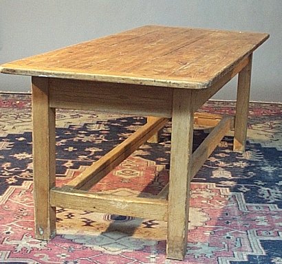 A scrubbed pine farmhouse refectory table