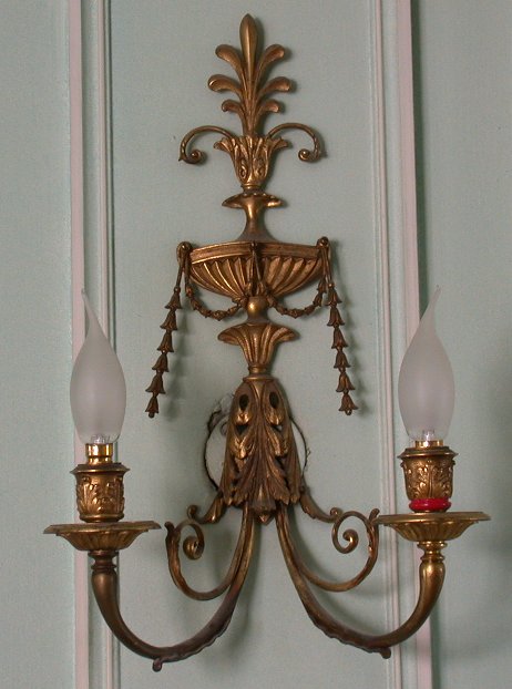 A pair of neoclassical style gilt bronze two branch wall lights