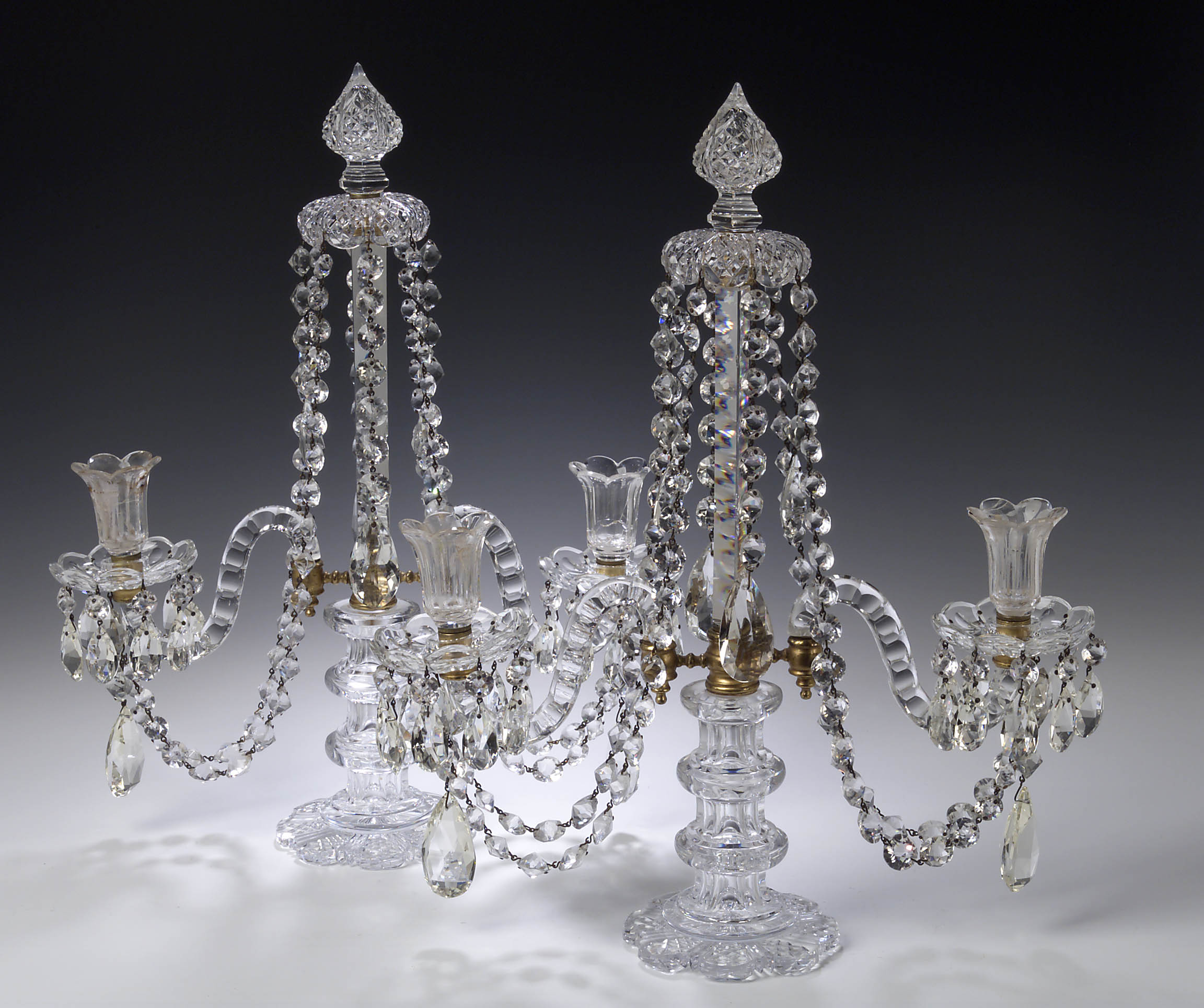 A pair of Edwardian cut glass table candelabra