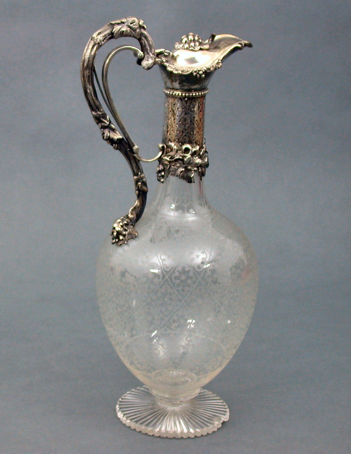 A Victorian mounted glass claret jug,