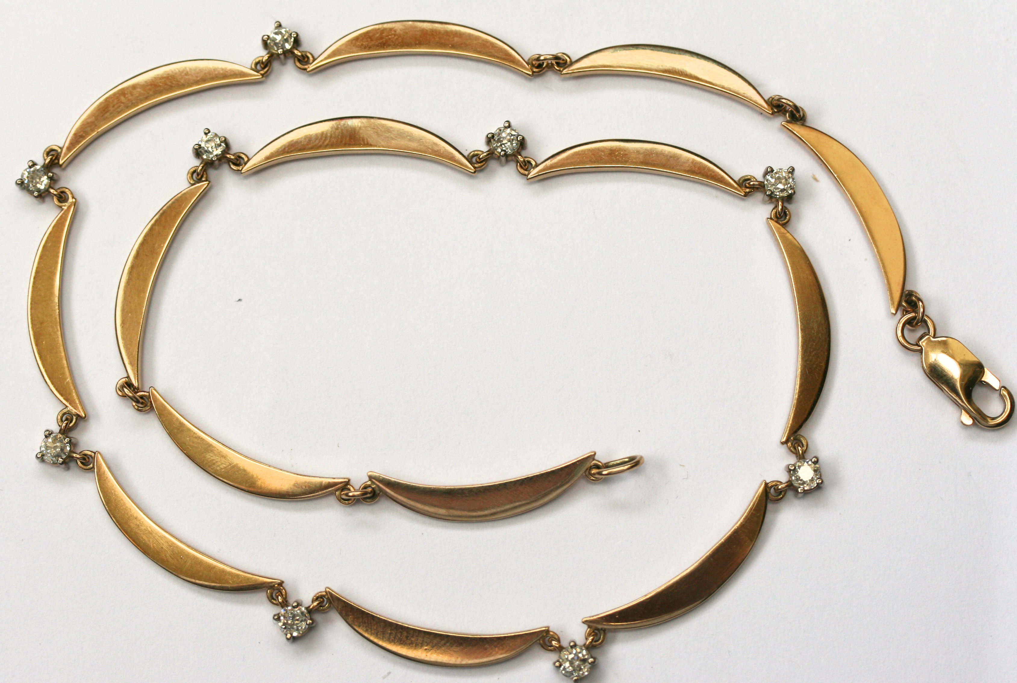 A contemporary 9ct gold diamond set necklace,