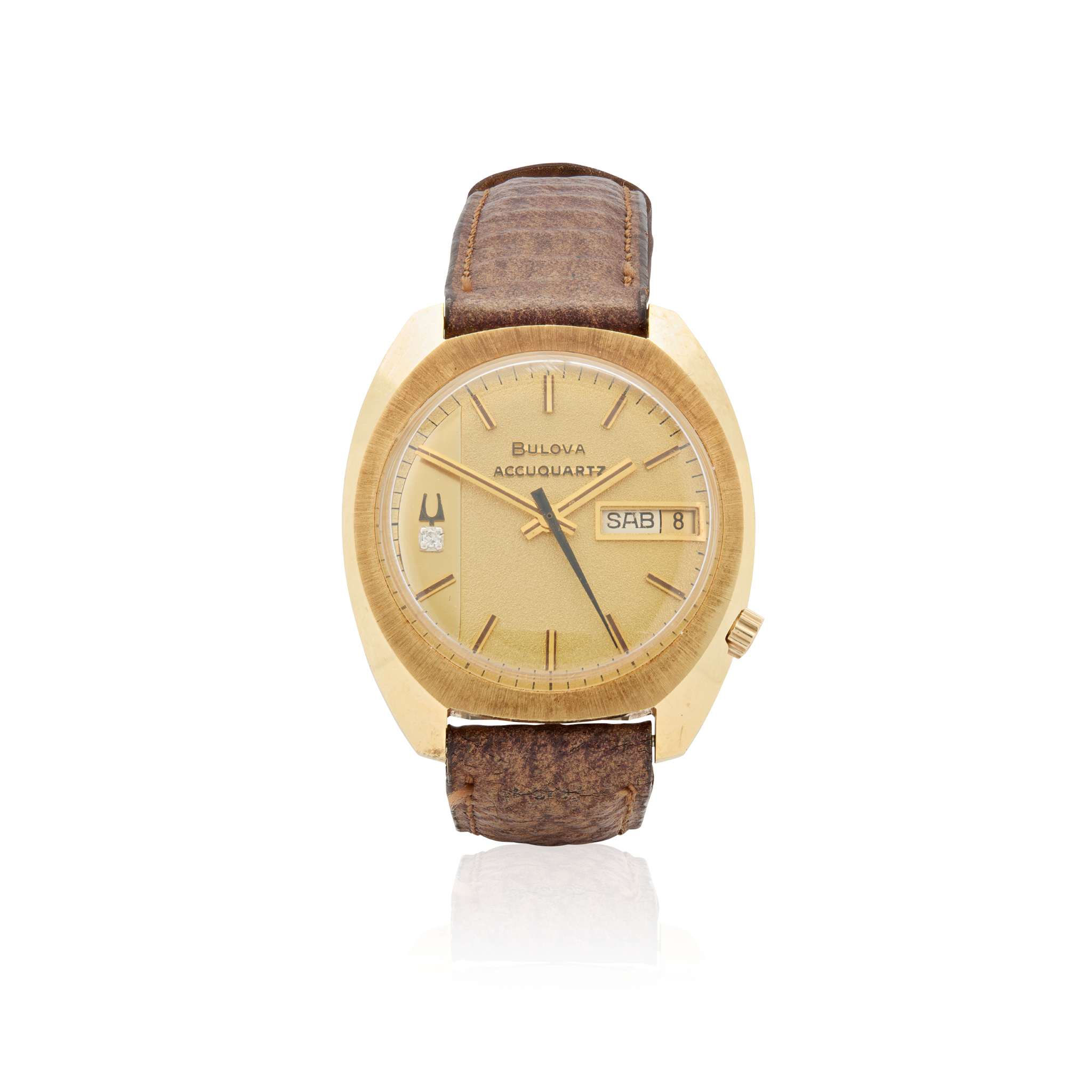 Bulova. A 14k gold electronic wristwatch