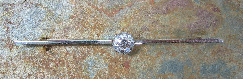 A diamond bar brooch,