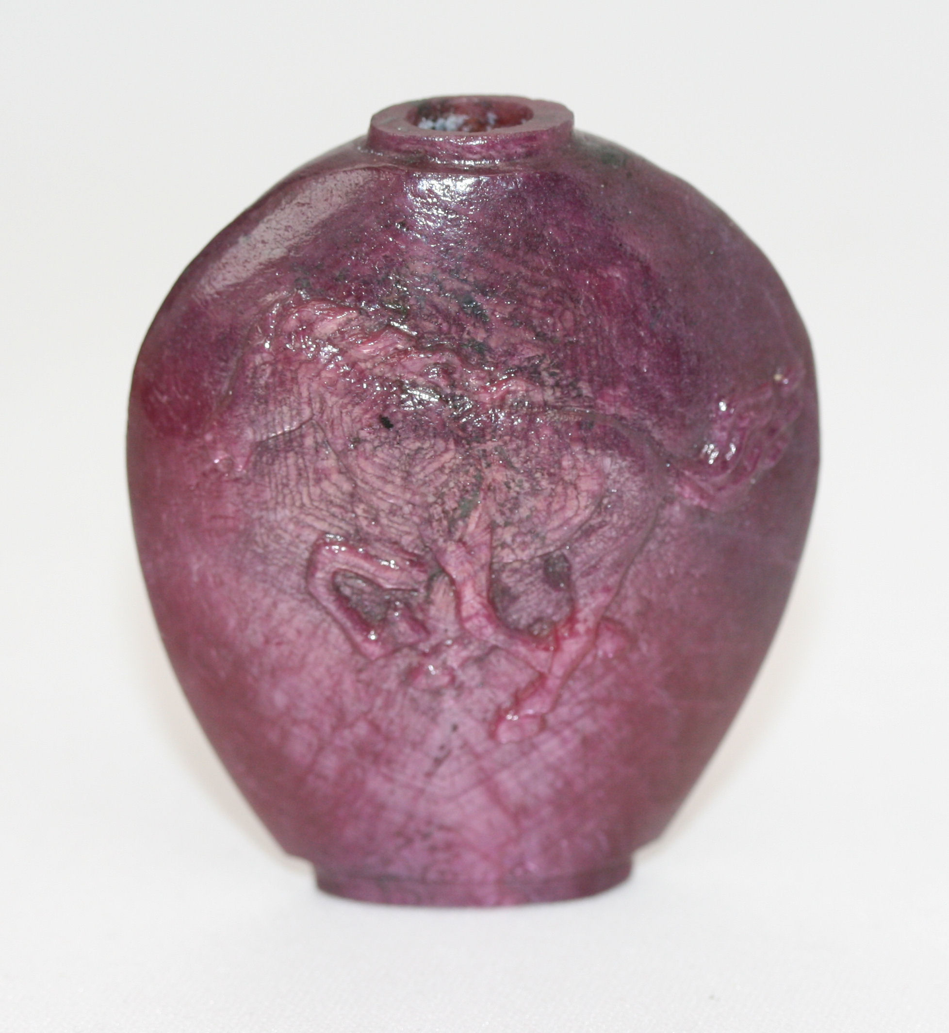 A carved ruby scent bottle