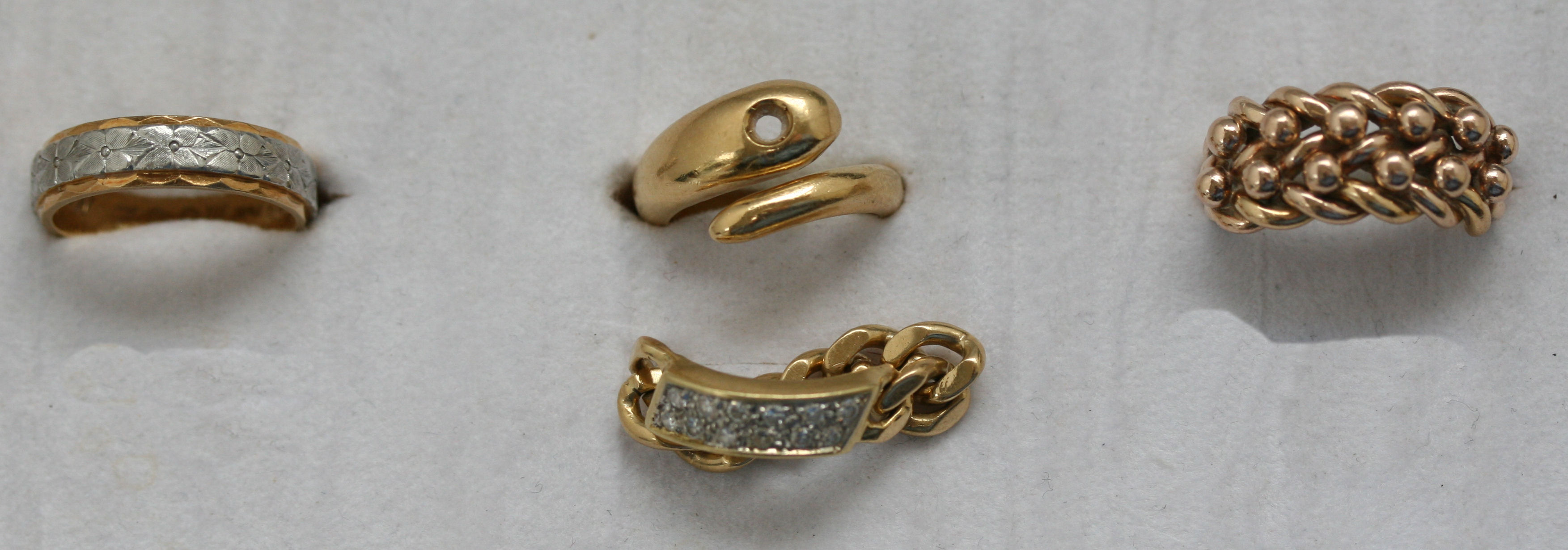 A group of four gold rings