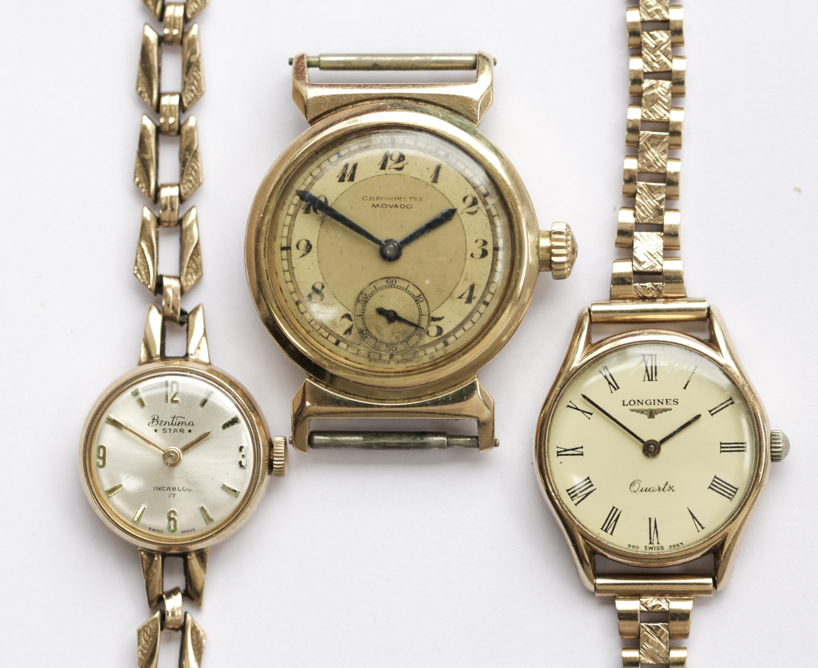 Three assorted gold watches