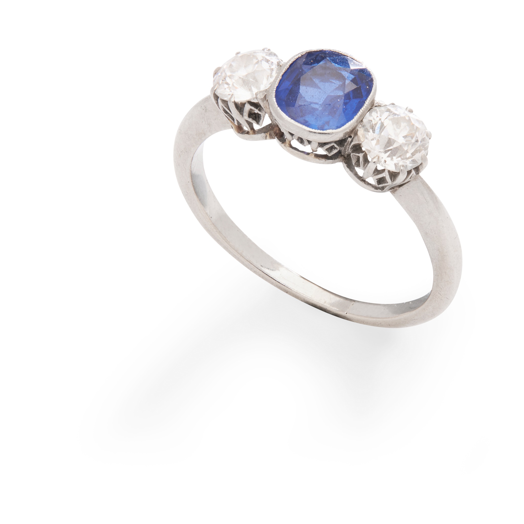 A three-stone sapphire and diamond ring