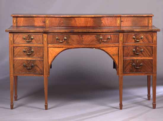 A George III mahogany serpentine sideboard