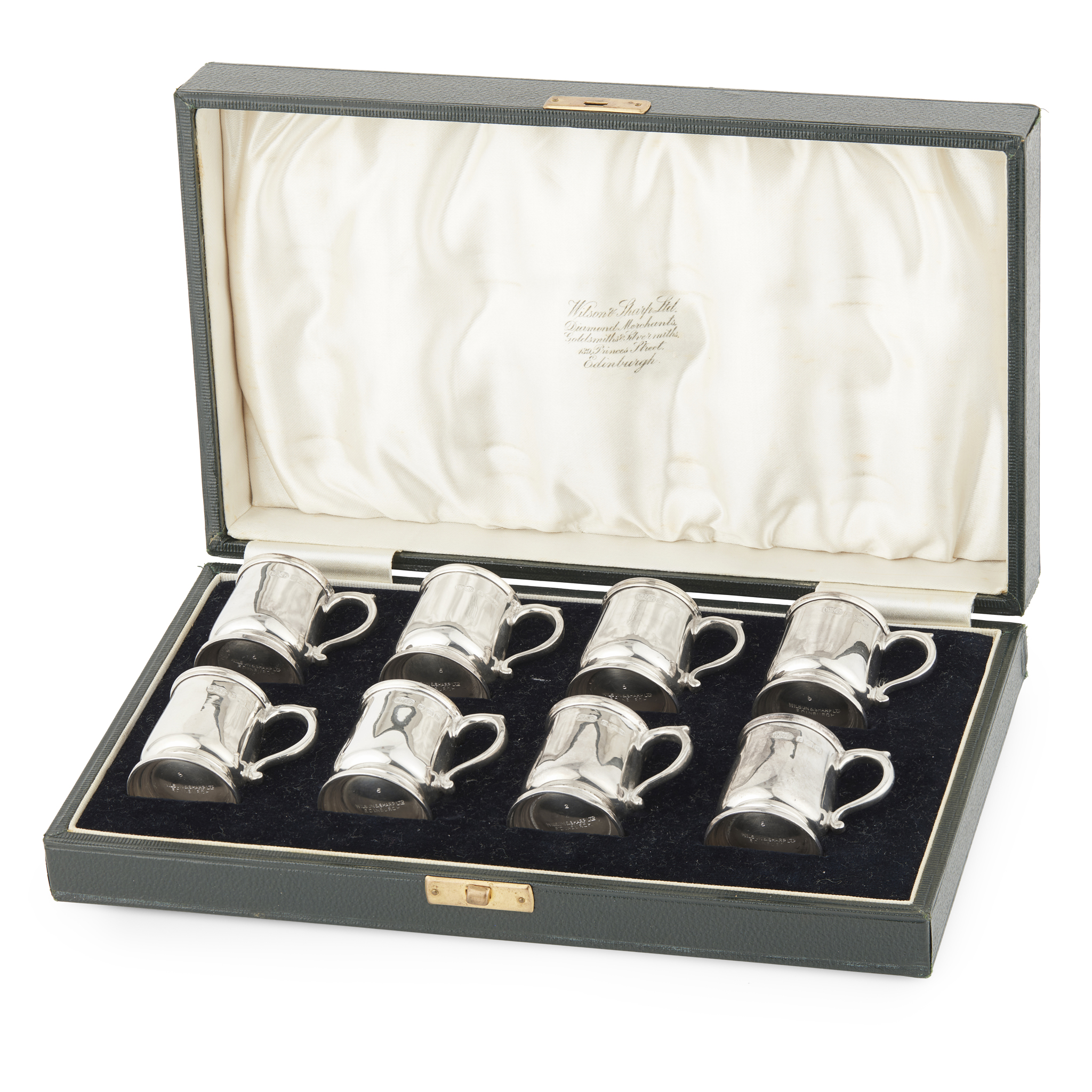 A CASED SET OF EIGHT MATCHED TOT CUPS