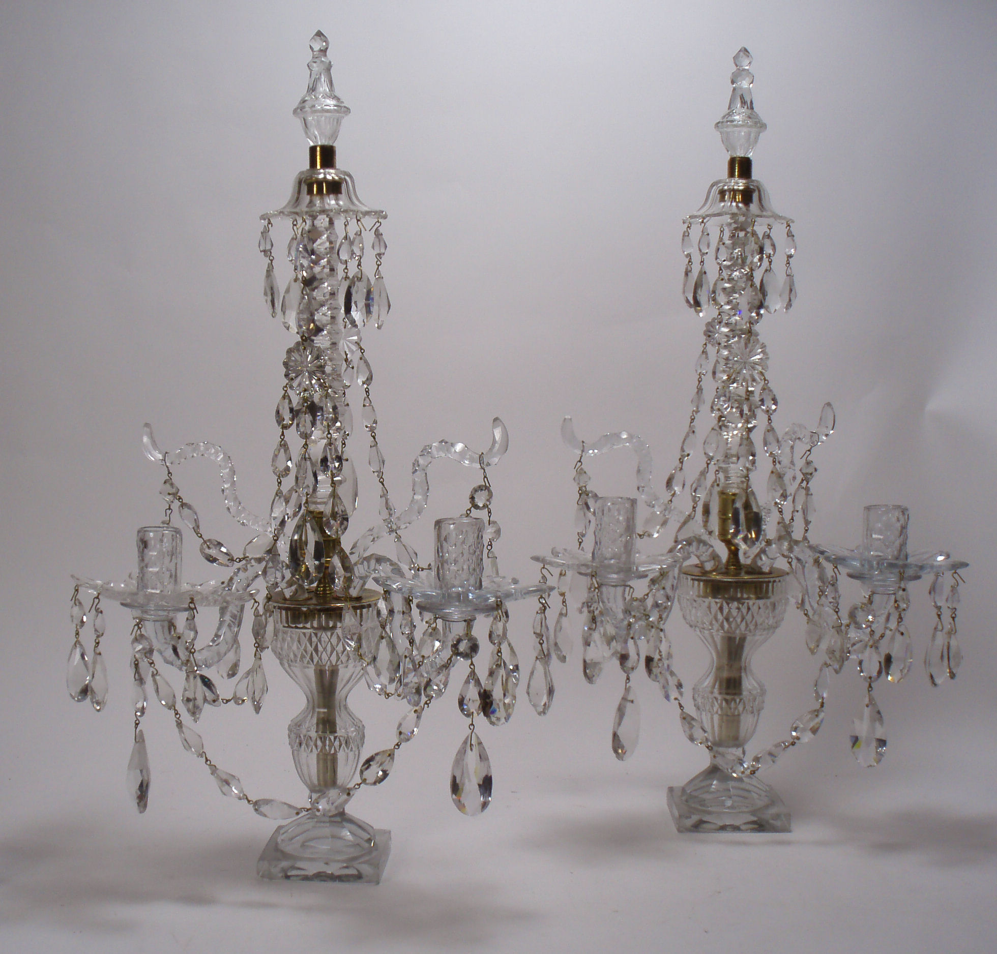 A pair of 19th century gilt and cut glass table candlelabra