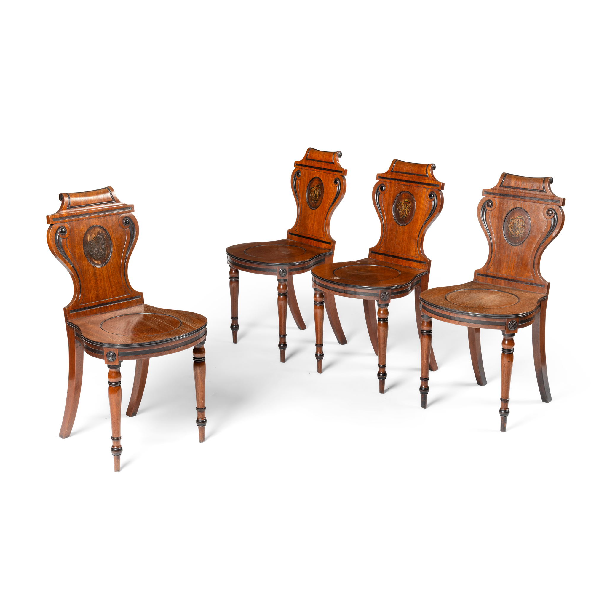 A SET OF FOUR MAHOGANY HALL CHAIRS