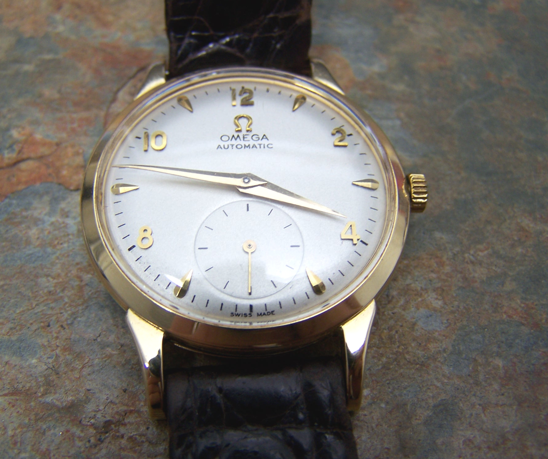 OMEGA - a gentleman's 18ct gold automatic wristwatch,