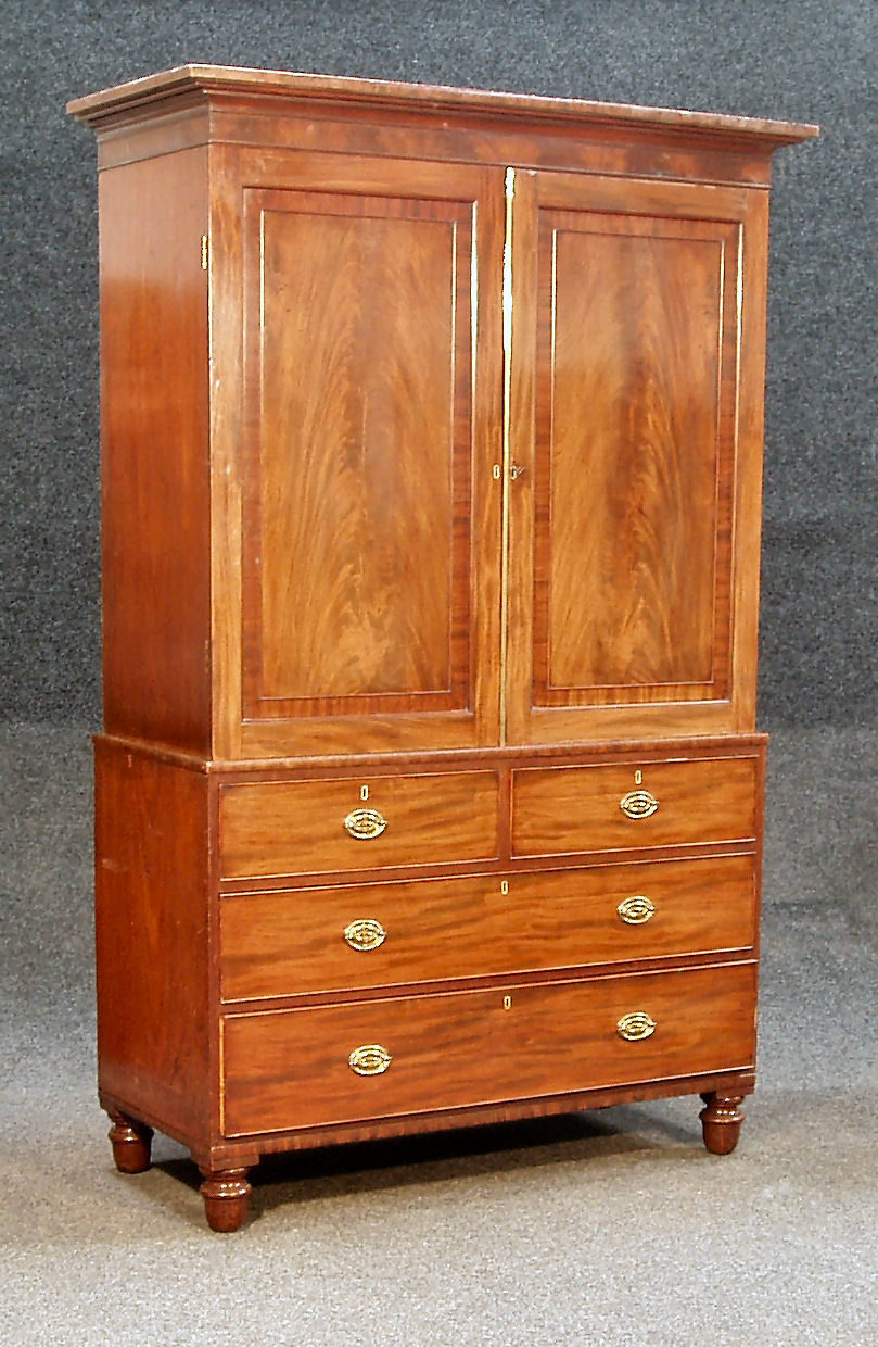 A 19th century mahogany linen press,