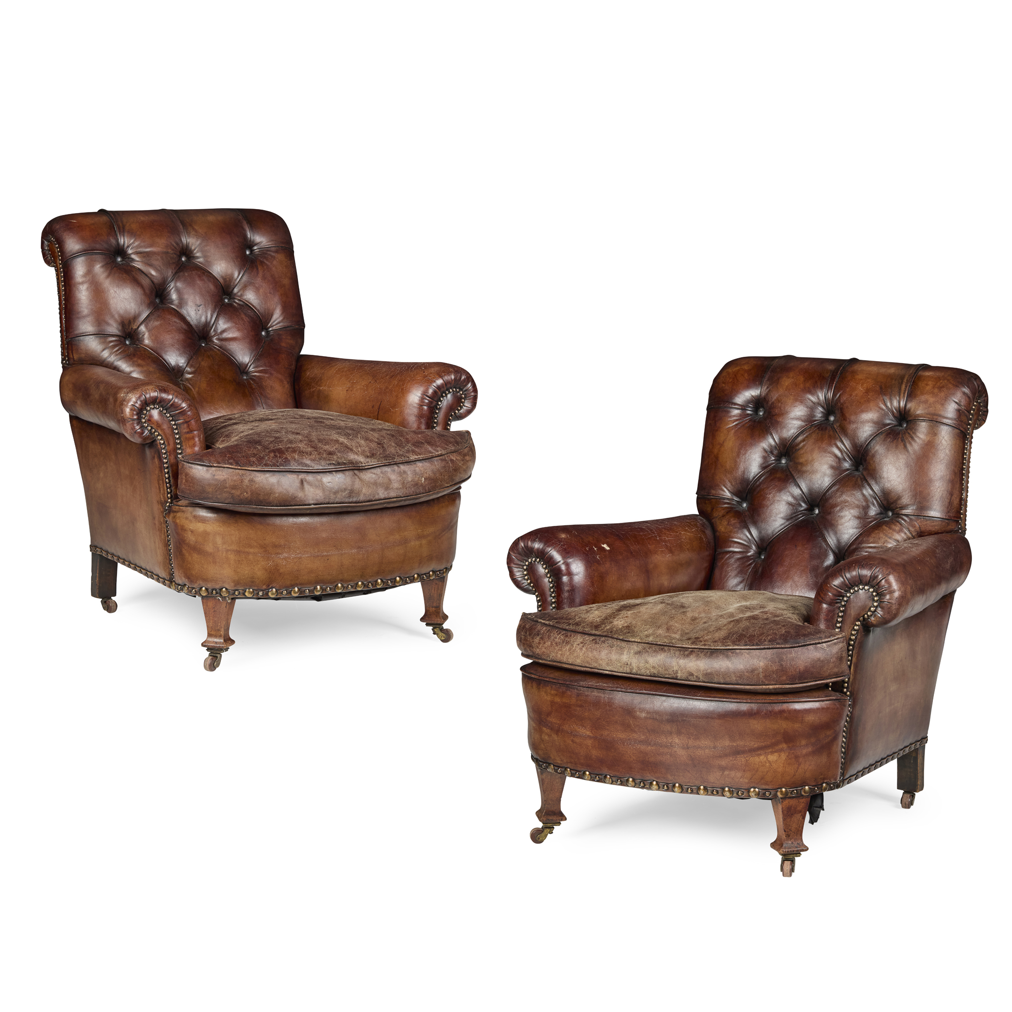 PAIR OF EDWARDIAN BROWN LEATHER UPHOLSTERED EASY ARMCHAIRS