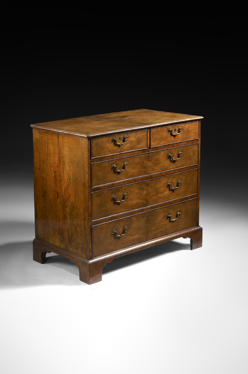 A George II period walnut chest of drawers