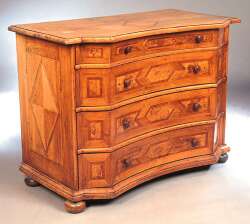 An early 19th century North German walnut and parquetry inlaid commode