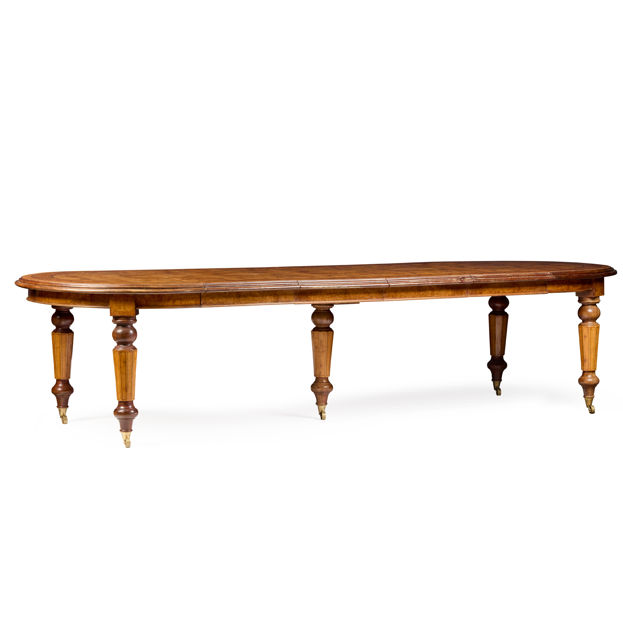 VICTORIAN STYLE WALNUT, BURR WALNUT, AMBOYNA, AND MAHOGANY EXTENDING DINING TABLE