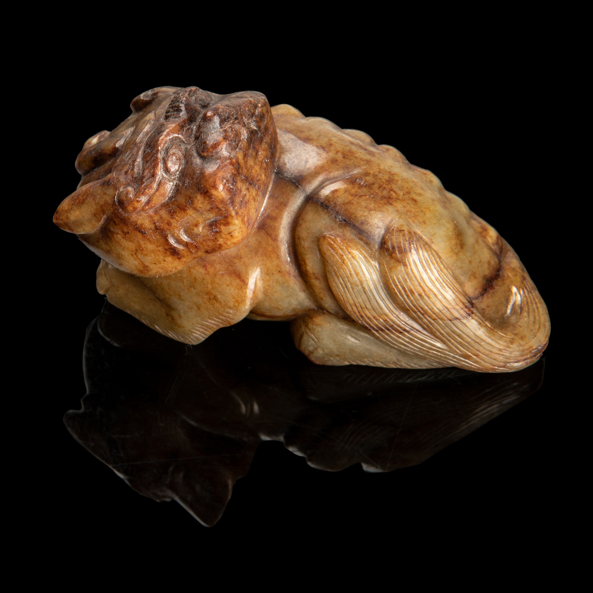 CELADON JADE WITH RUSSET SKIN CARVING OF A LUDUAN