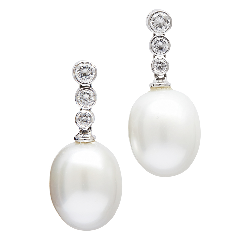 A pair of pearl and diamond set earrings