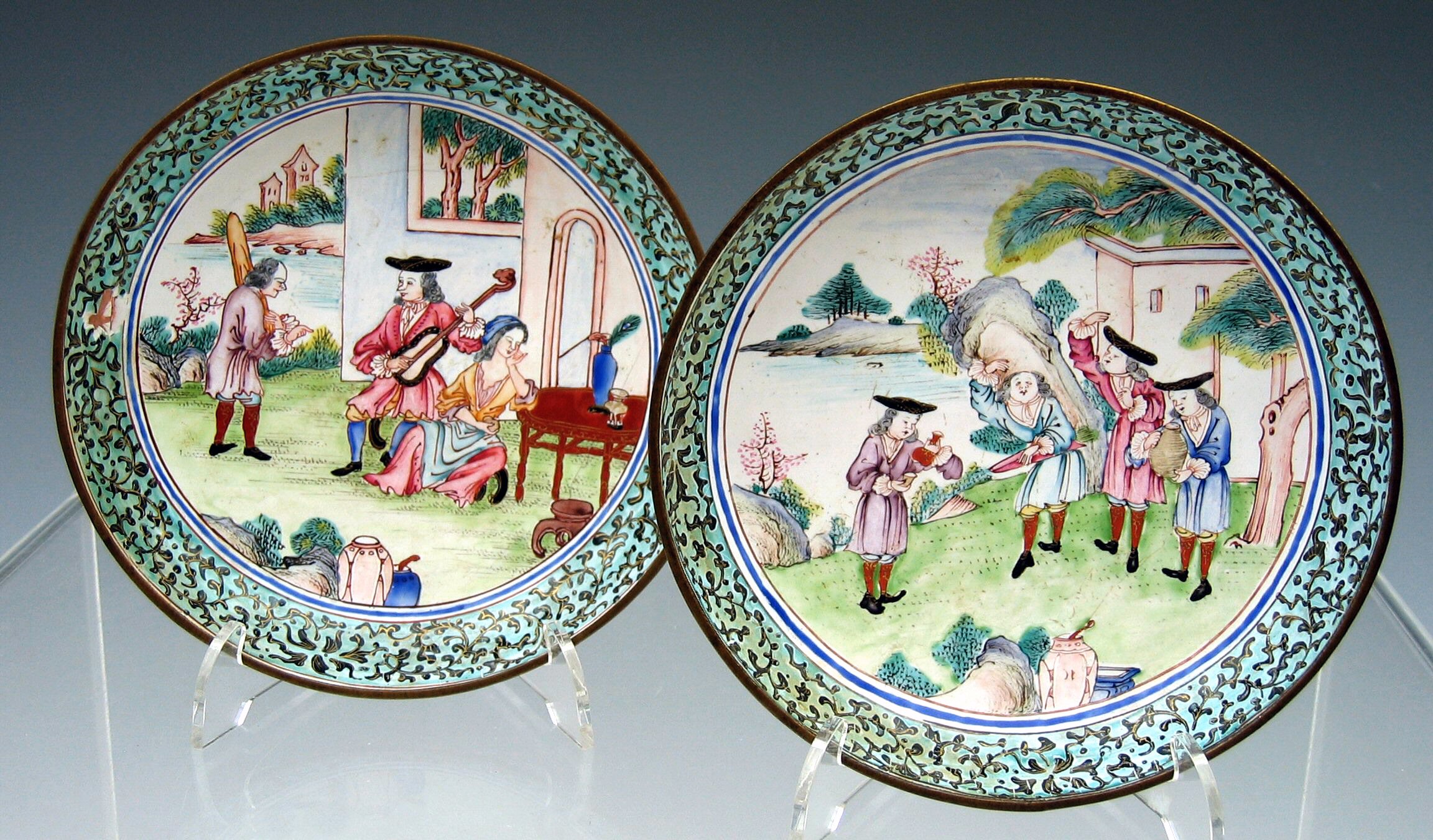 A pair of Canton polychrome enamel circular footed plates, 18th century,