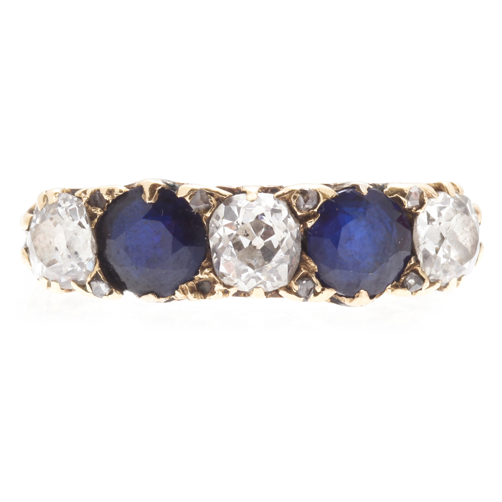 A sapphire and diamond set five stone ring