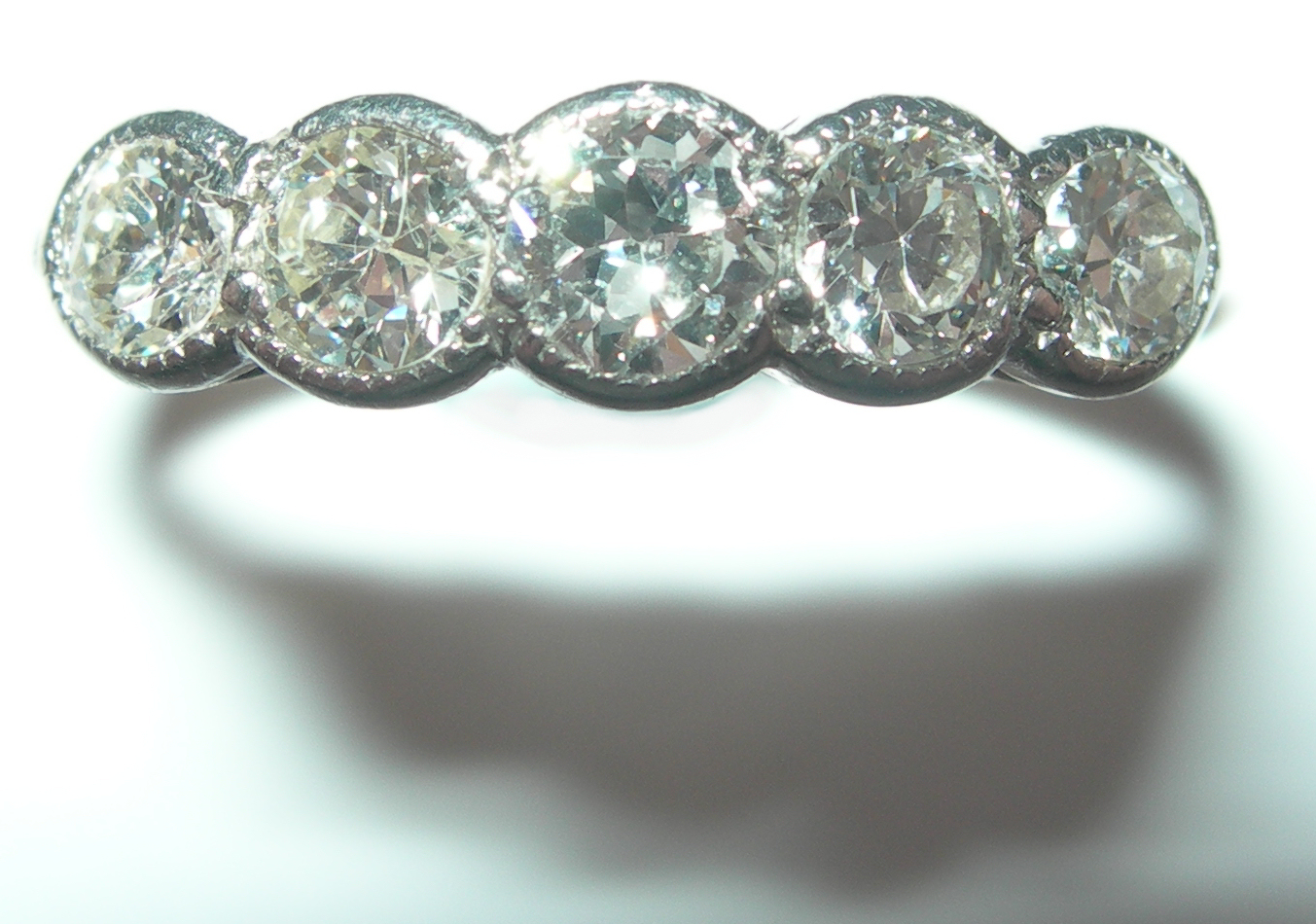 An 18ct gold mounted five-stone diamond ring,