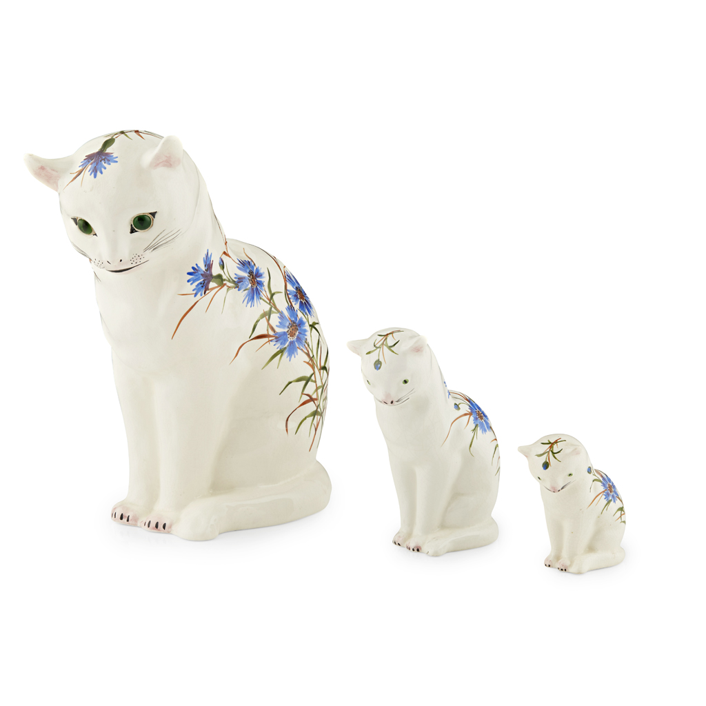 A GRADUATED SET OF THREE PLICTHA CATS