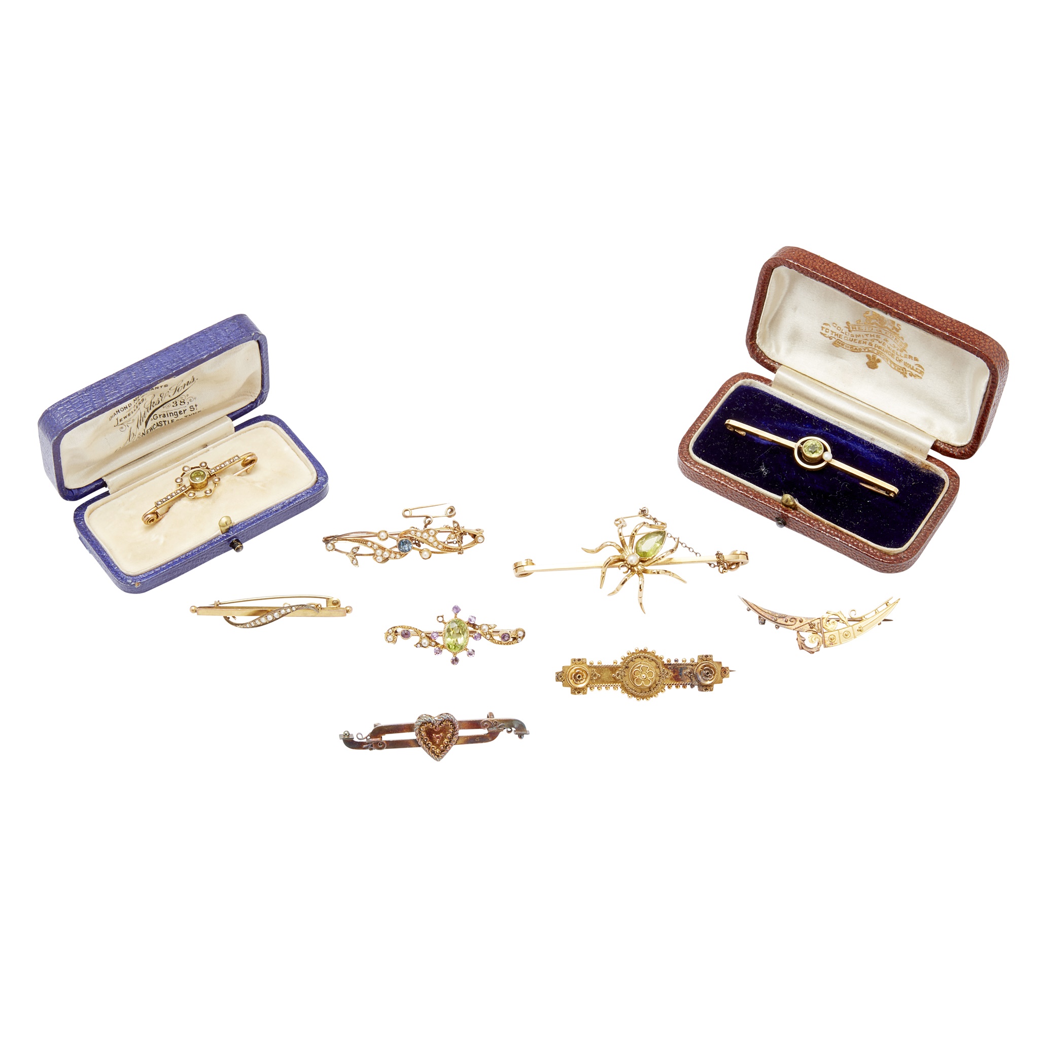 A collection of gem set brooches