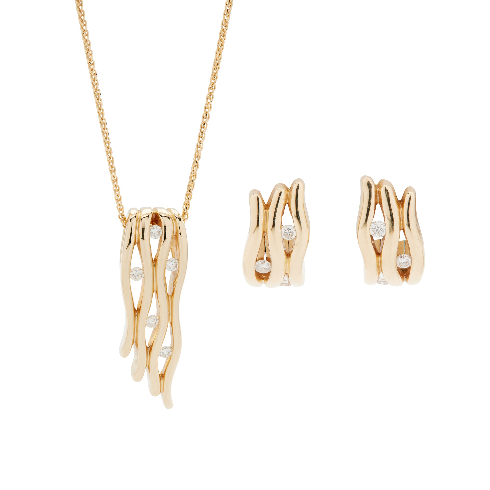 A diamond pendant and matching earrings