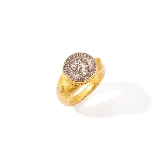An antique coin dress ring