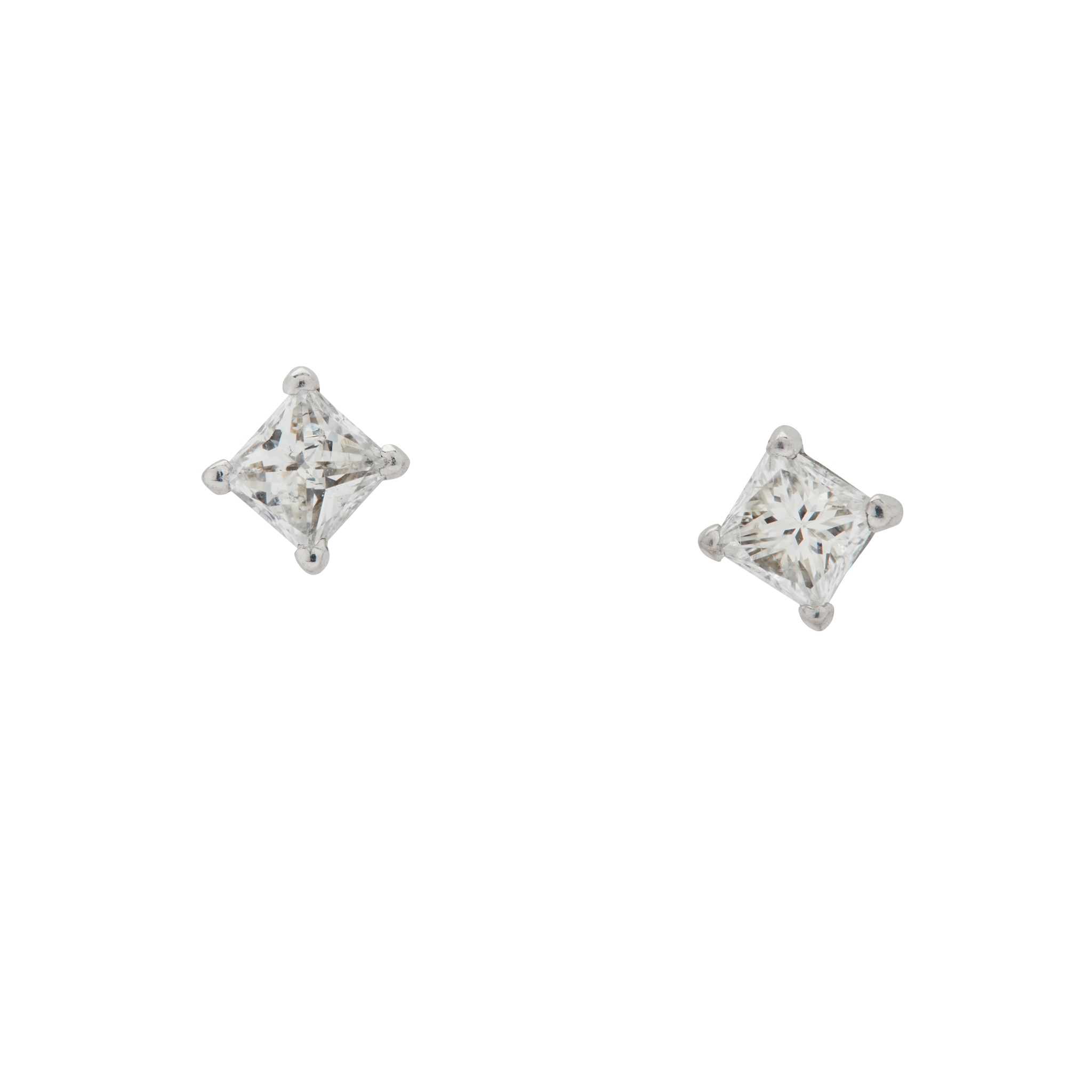 A pair of diamond stud earrings