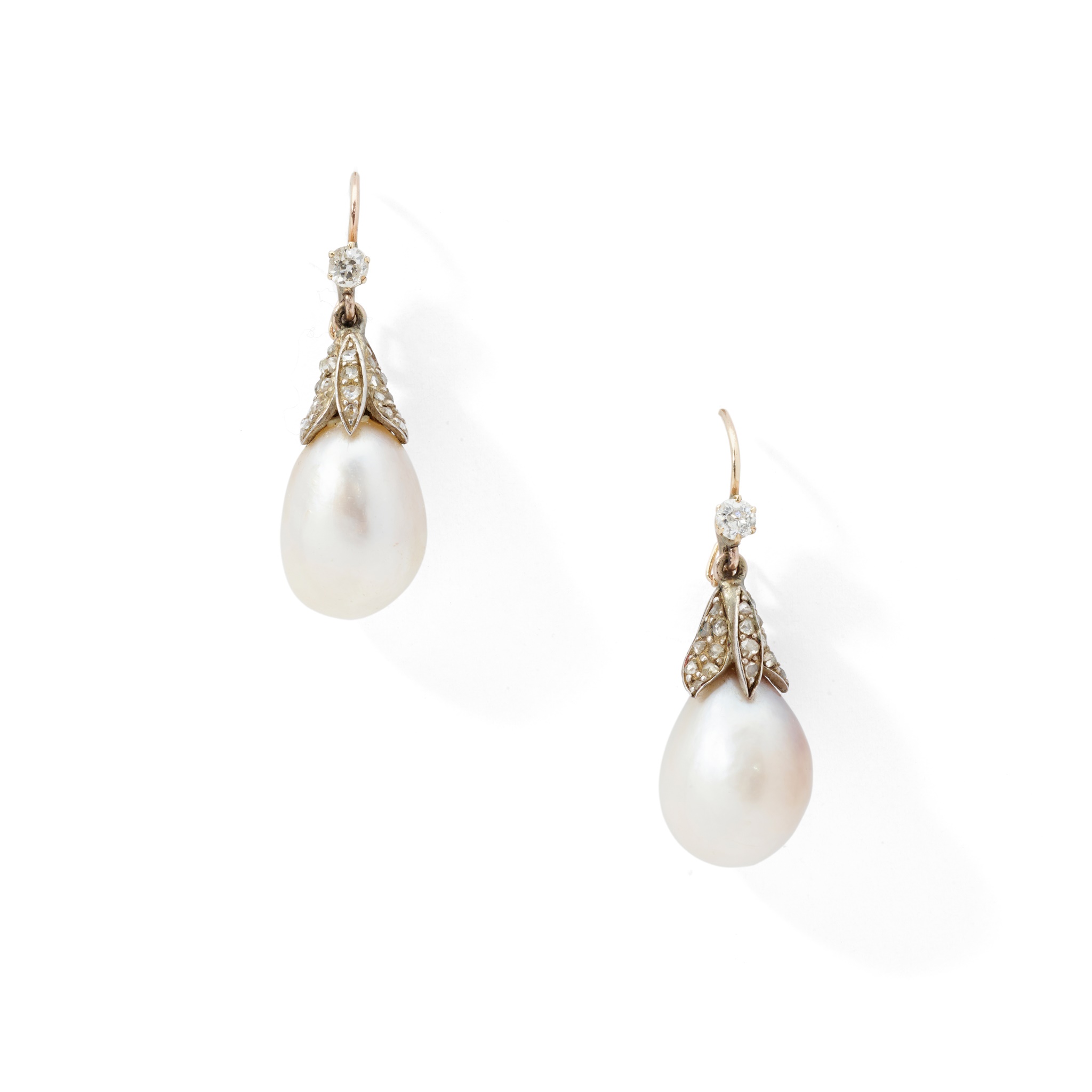 A pair of natural pearl and diamond earrings