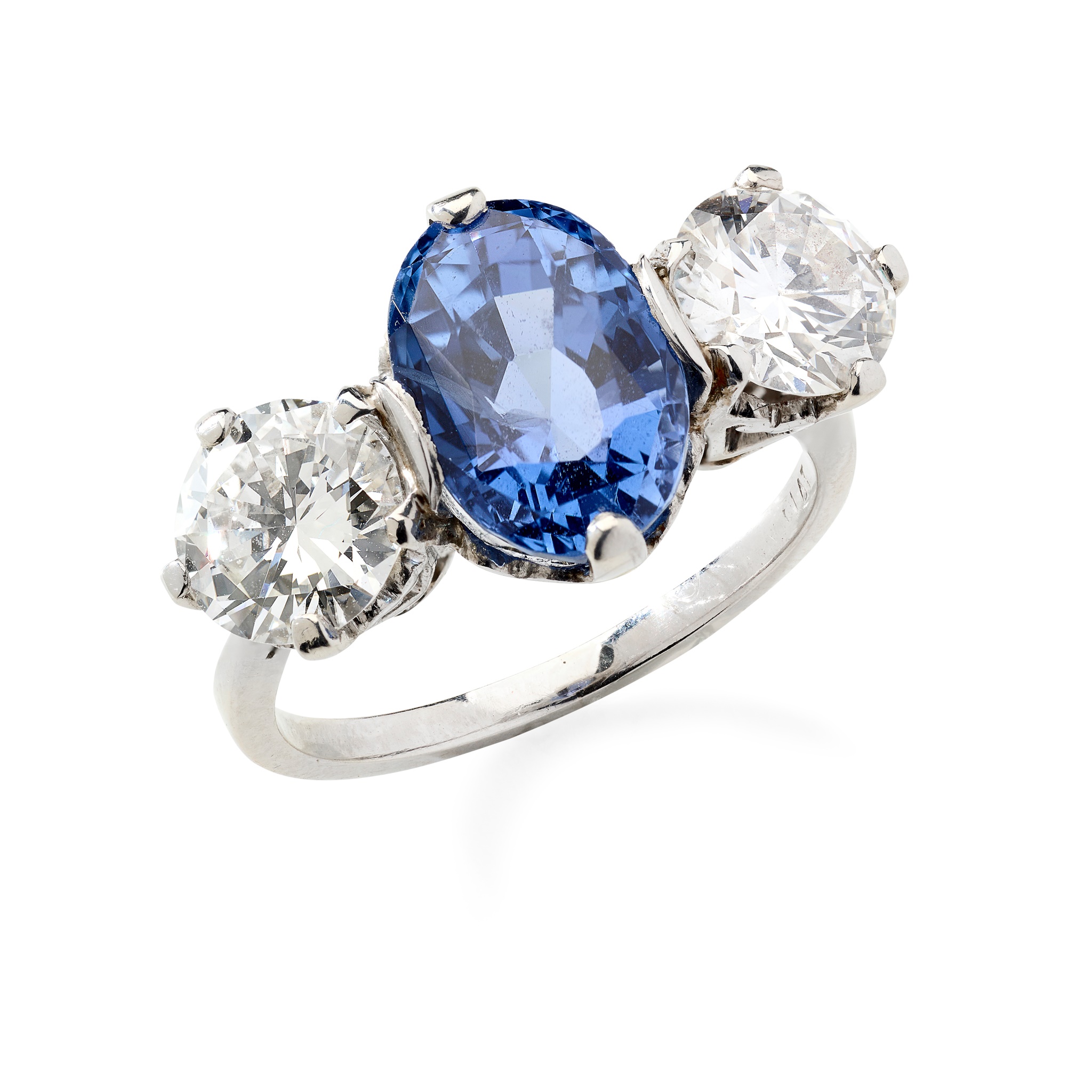 A sapphire and diamond three-stone ring