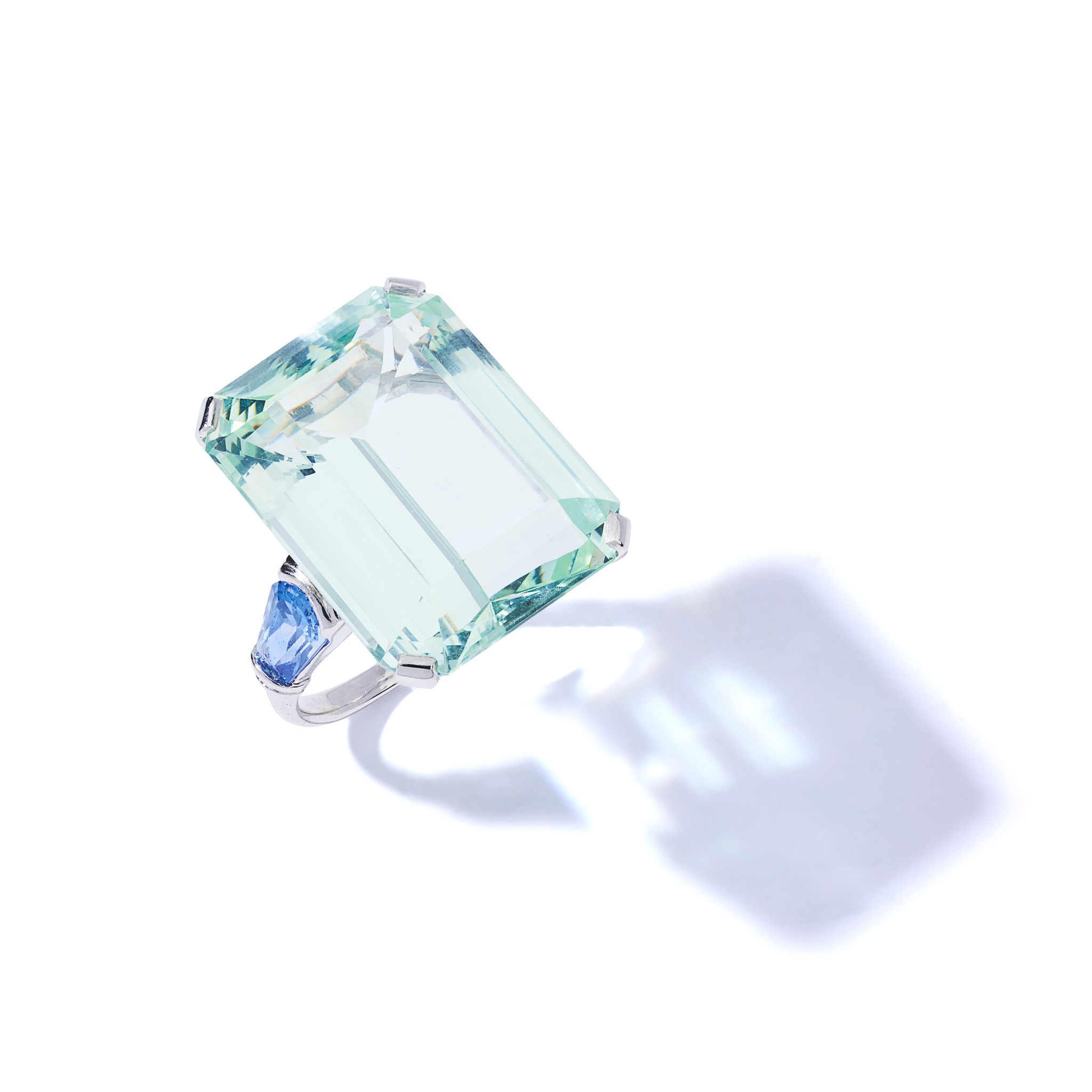 An aquamarine and sapphire dress ring
