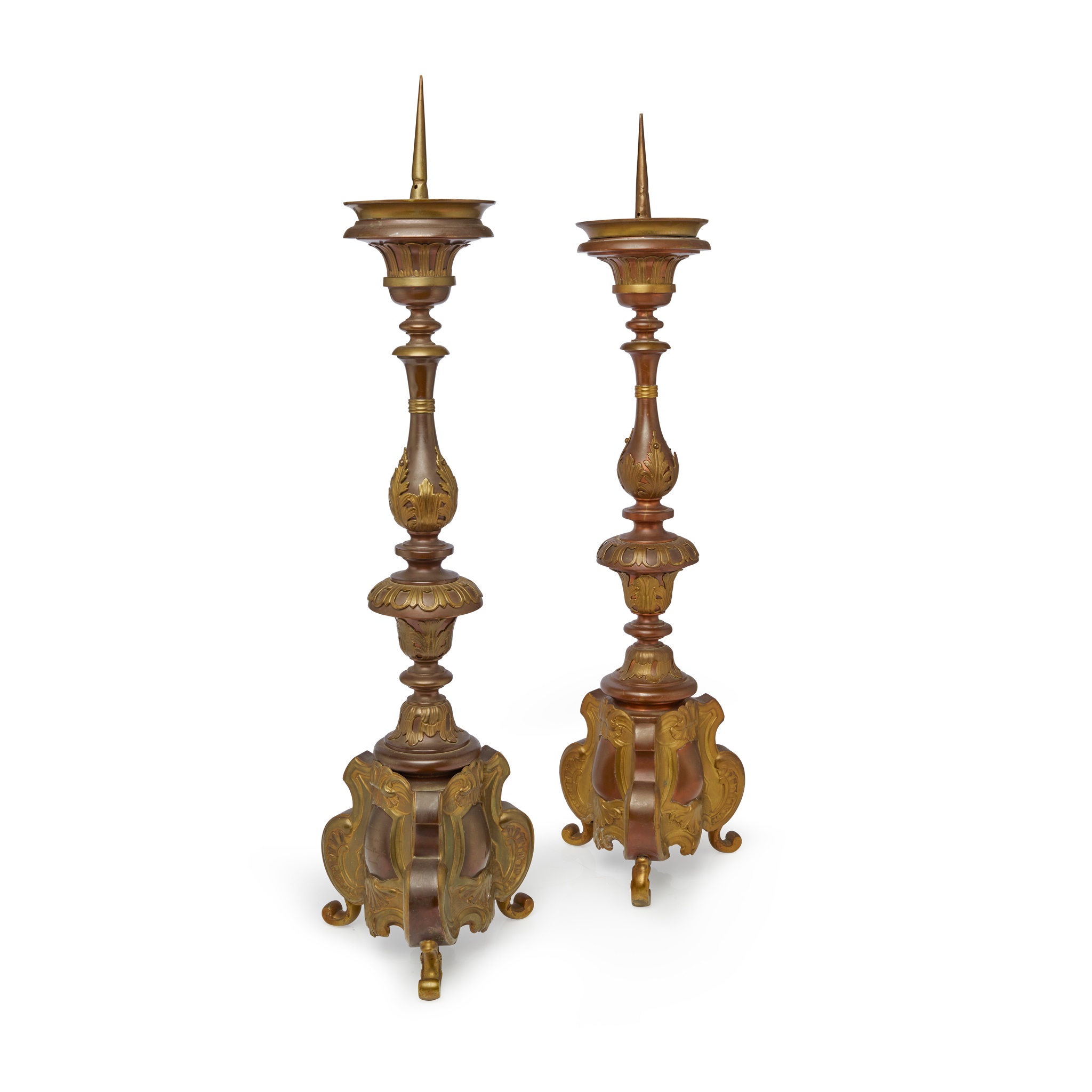 PAIR OF CONTINENTAL COPPER AND BRASS REPOUSSÉ PRICKET CANDLESTICKS