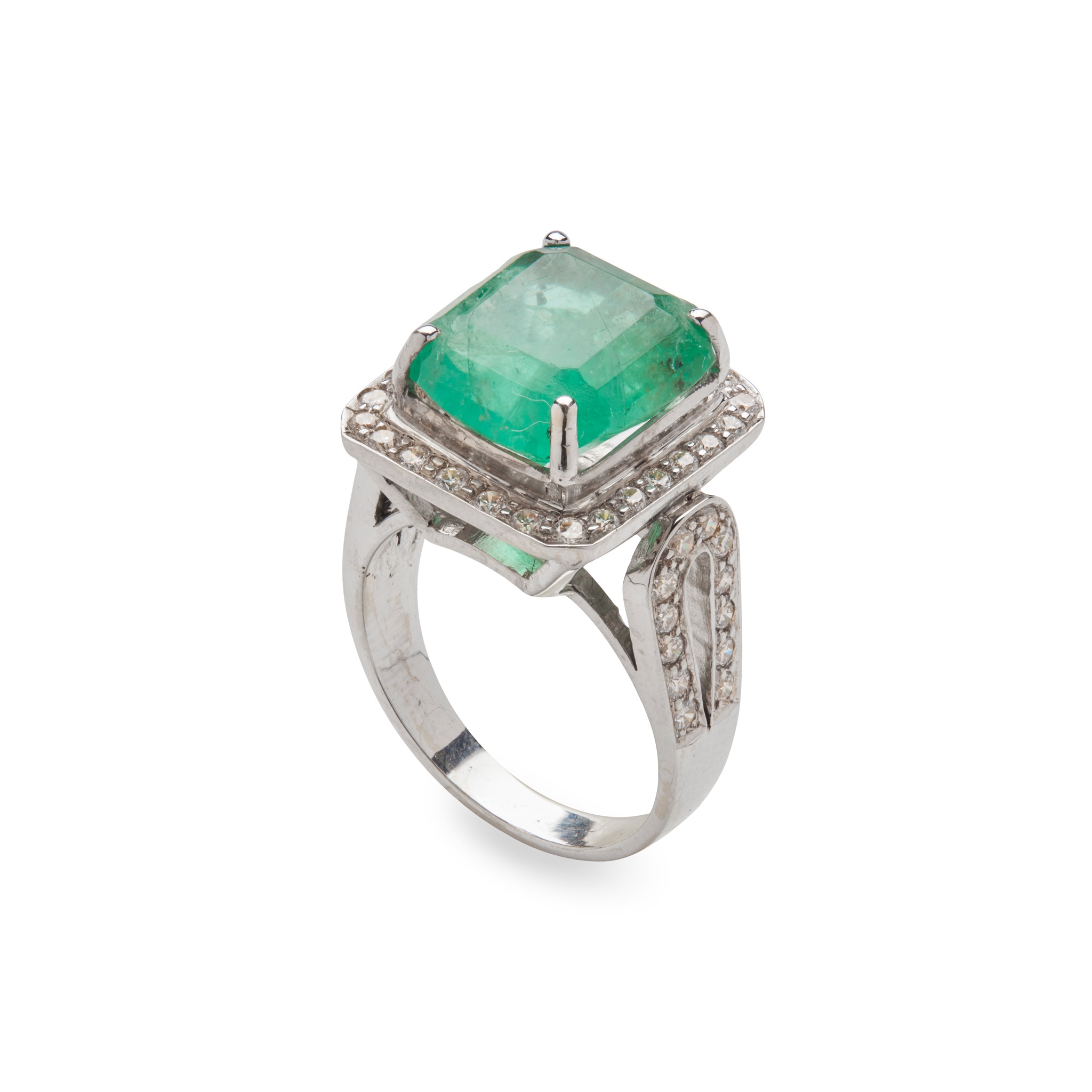 An emerald and diamond ring