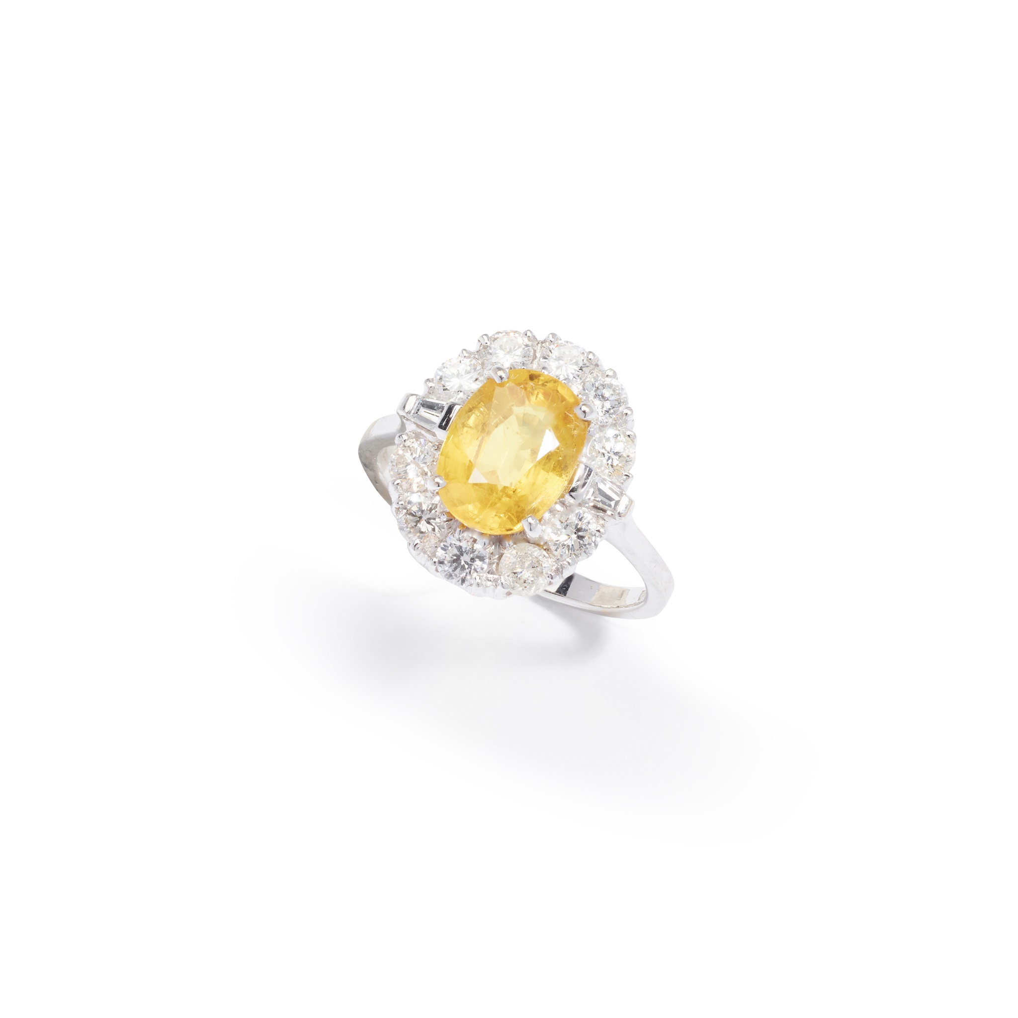 A yellow sapphire and diamond cluster ring