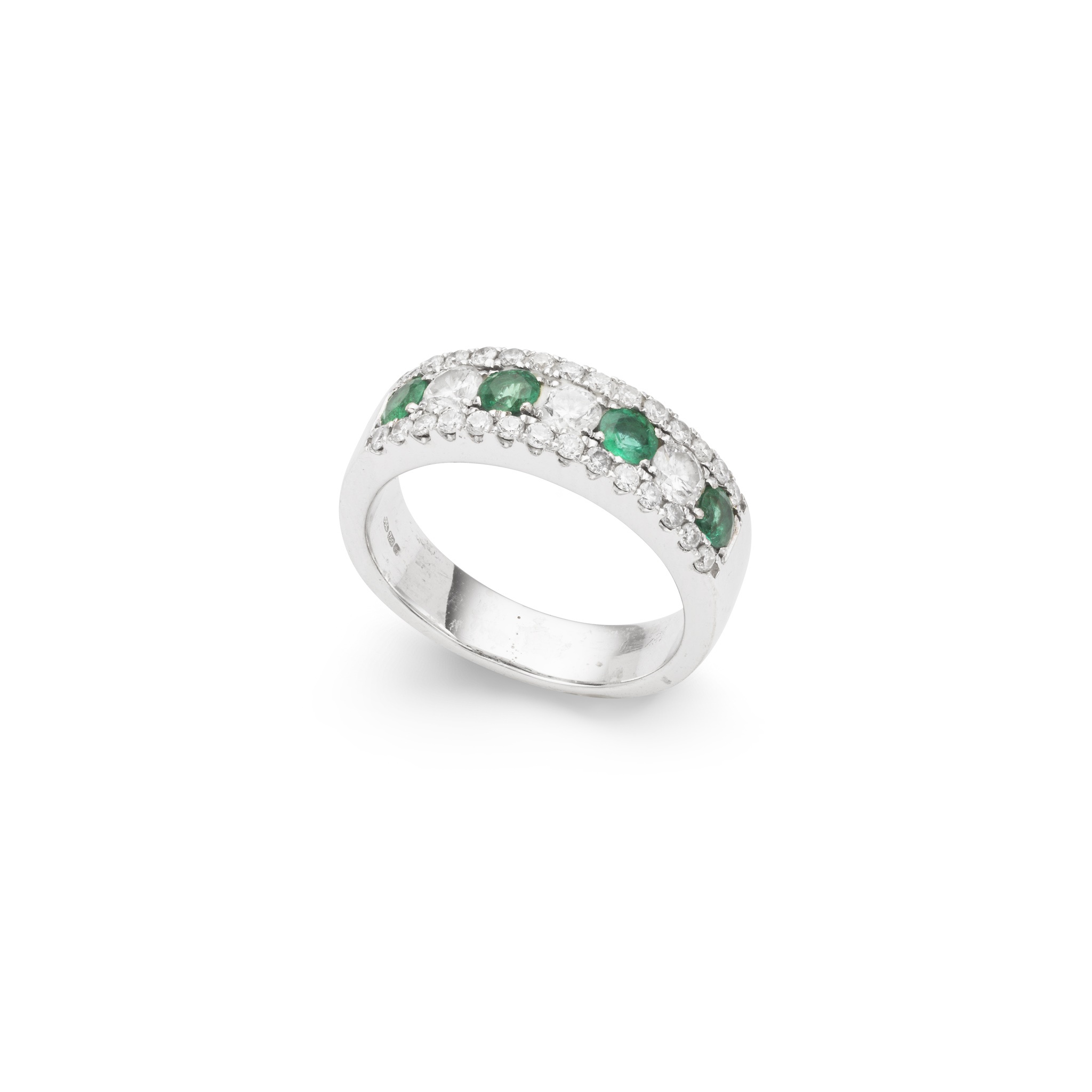 An emerald and diamond half-eternity ring